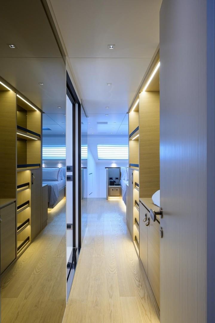 a hallway with cabinets and a door aboard NINIPOP XL Yacht for Sale