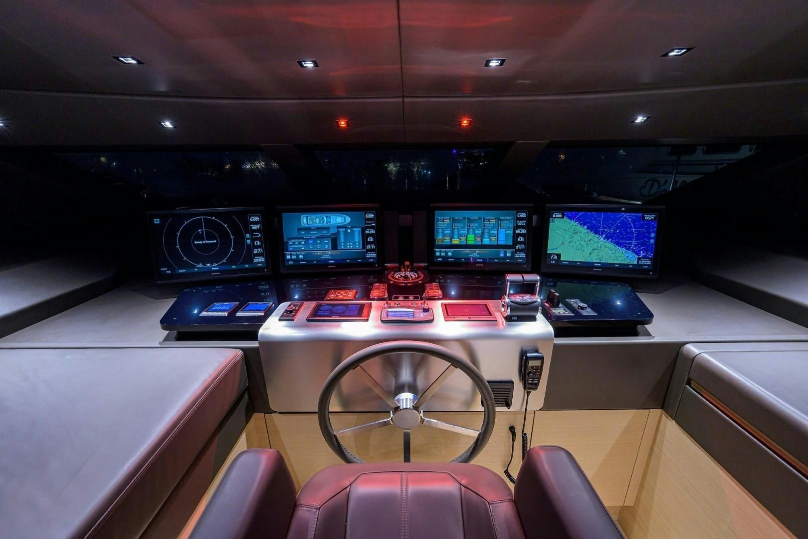 a room with many monitors and a chair aboard NINIPOP XL Yacht for Sale