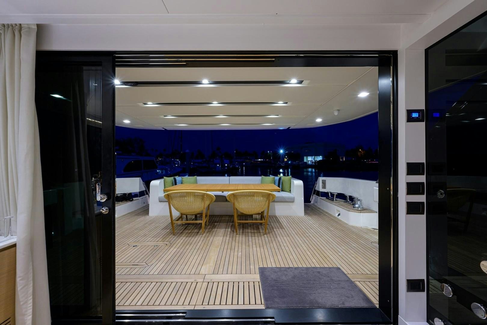 a room with a table and chairs aboard NINIPOP XL Yacht for Sale