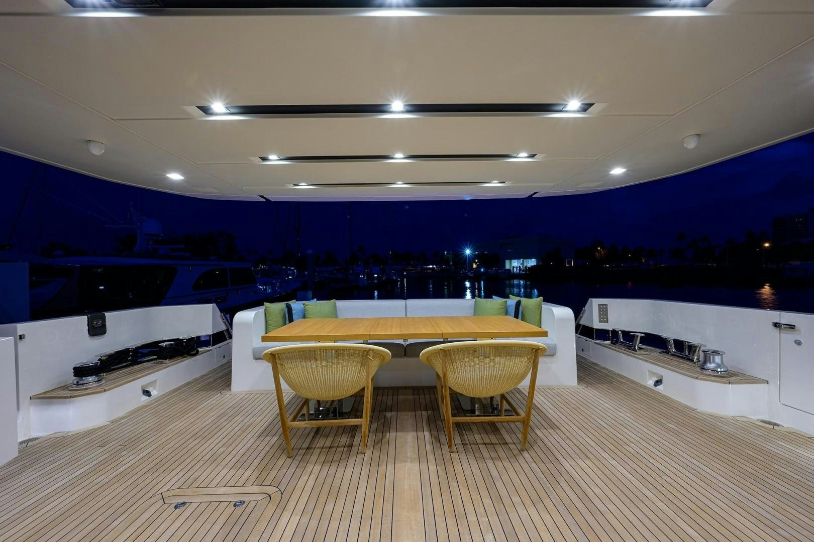 a kitchen with a table and chairs aboard NINIPOP XL Yacht for Sale