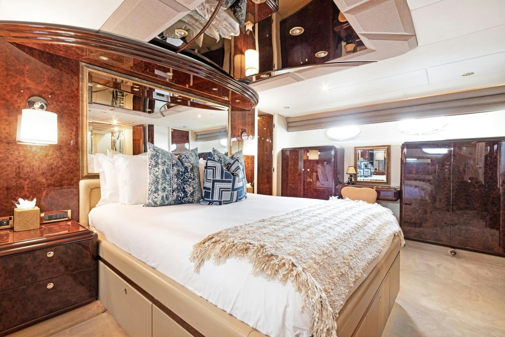 a large bed in a room aboard BELLA GIORNATA Yacht for Sale