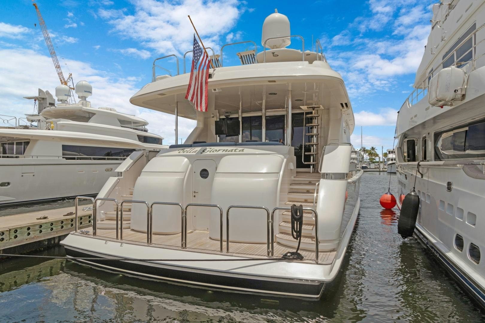a boat docked at a pier aboard BELLA GIORNATA Yacht for Sale