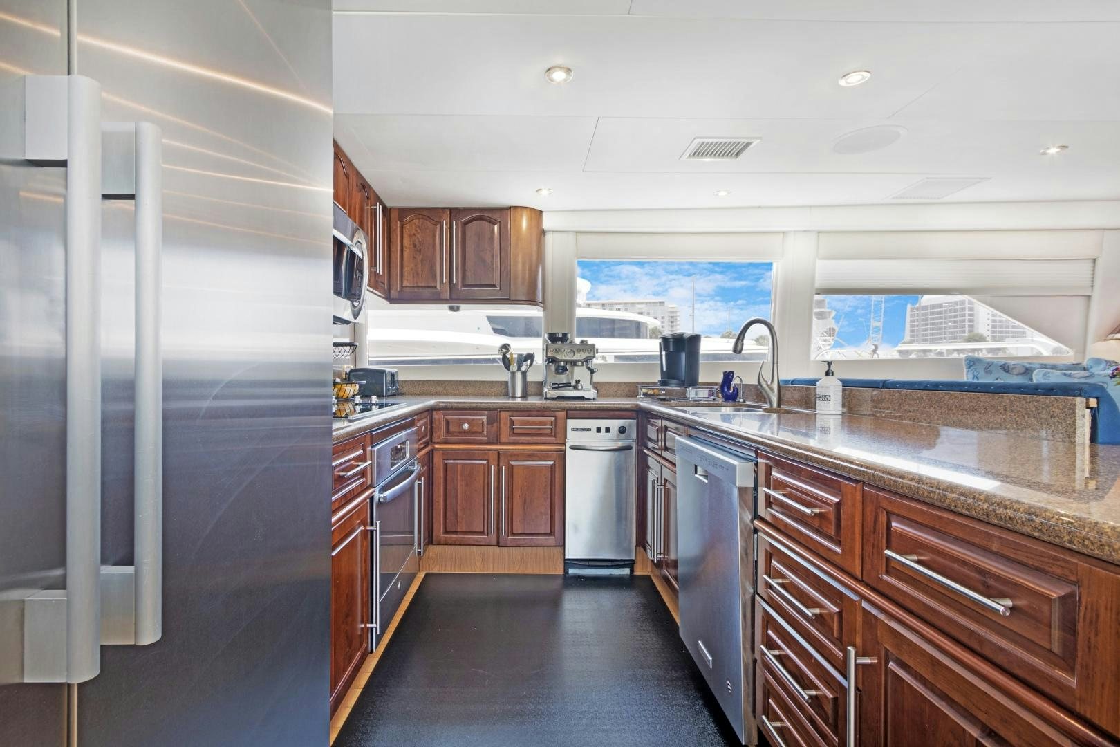 a kitchen with a large refrigerator aboard BELLA GIORNATA Yacht for Sale
