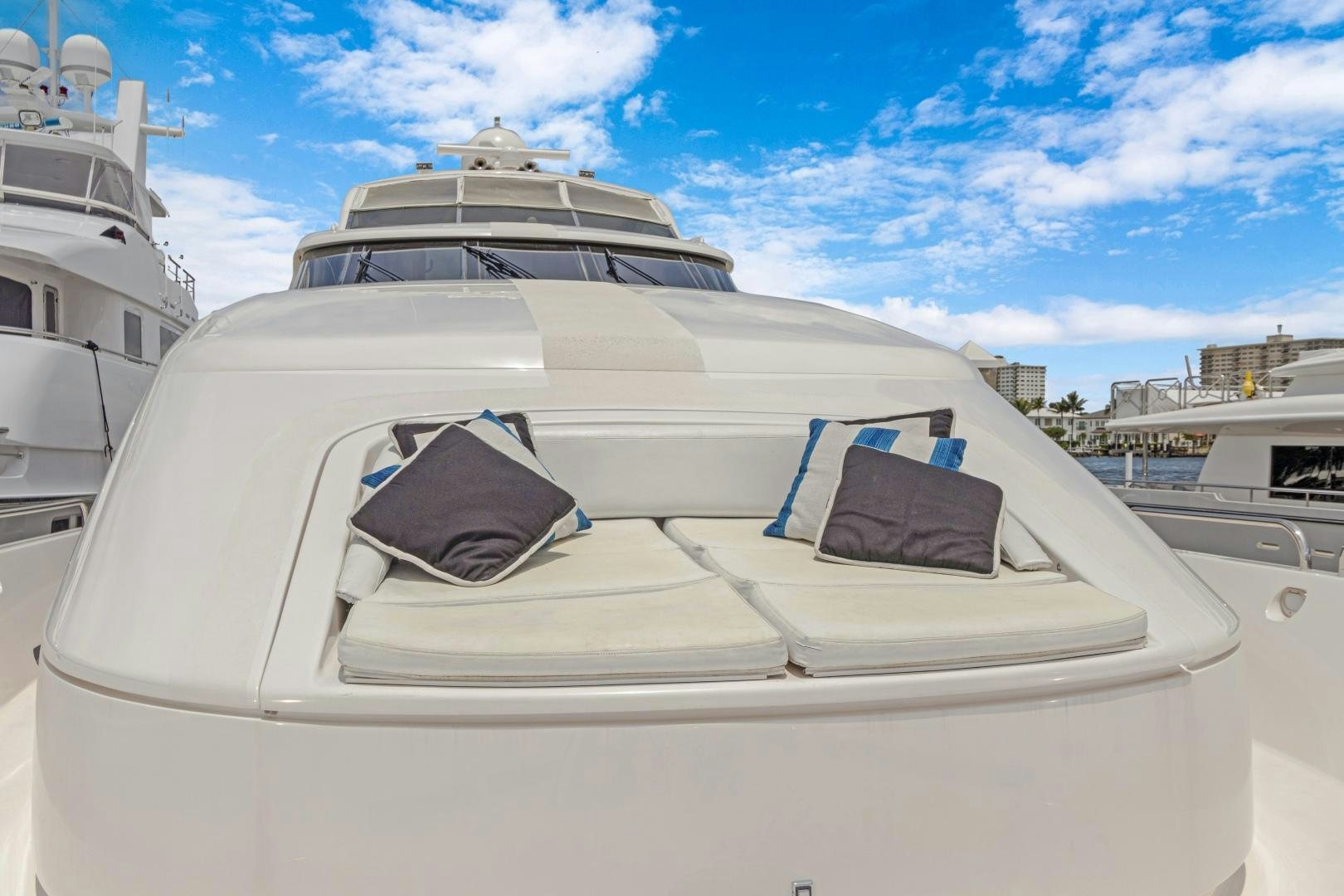 a white yacht with a seat aboard BELLA GIORNATA Yacht for Sale