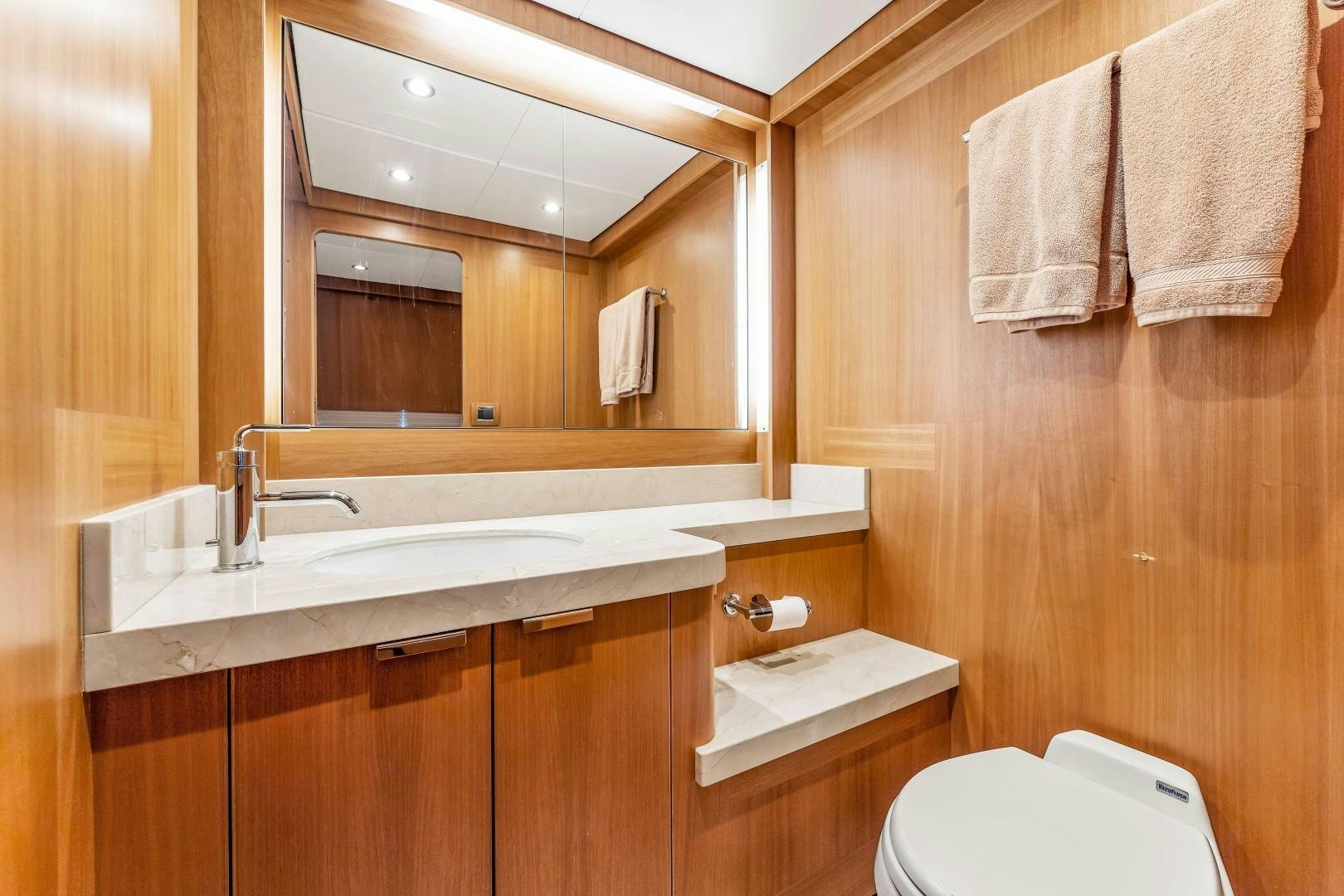 a bathroom with a sink and toilet aboard No Name Yacht for Sale