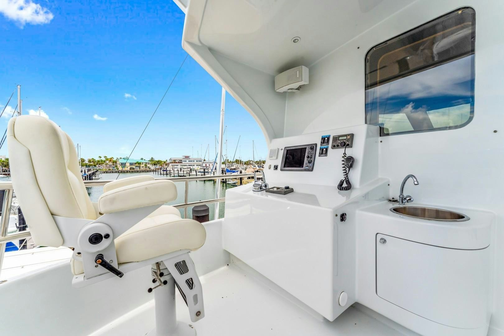 a white bathroom with a sink and a bathtub aboard No Name Yacht for Sale