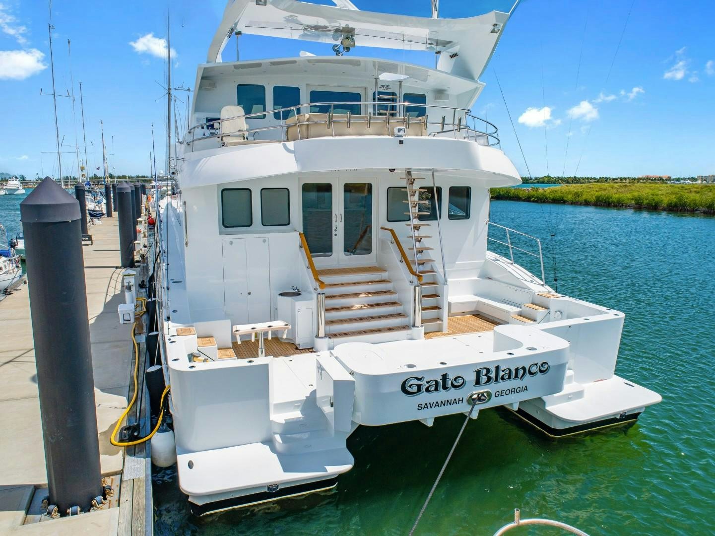 a boat docked at a pier aboard No Name Yacht for Sale