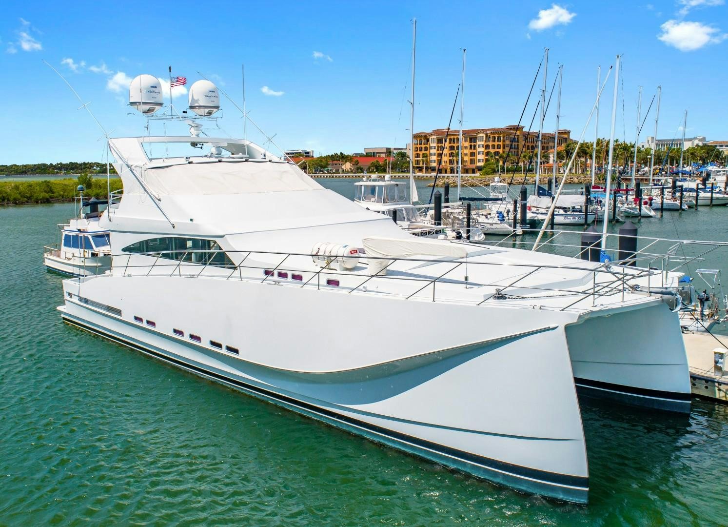 a large white yacht docked aboard No Name Yacht for Sale