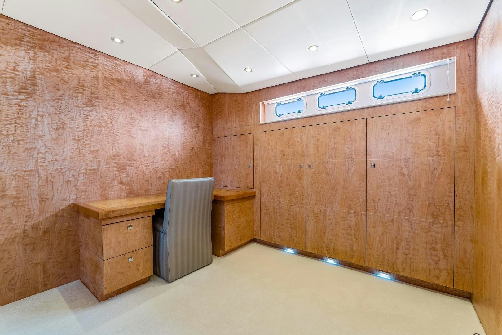 a room with wooden cabinets aboard No Name Yacht for Sale