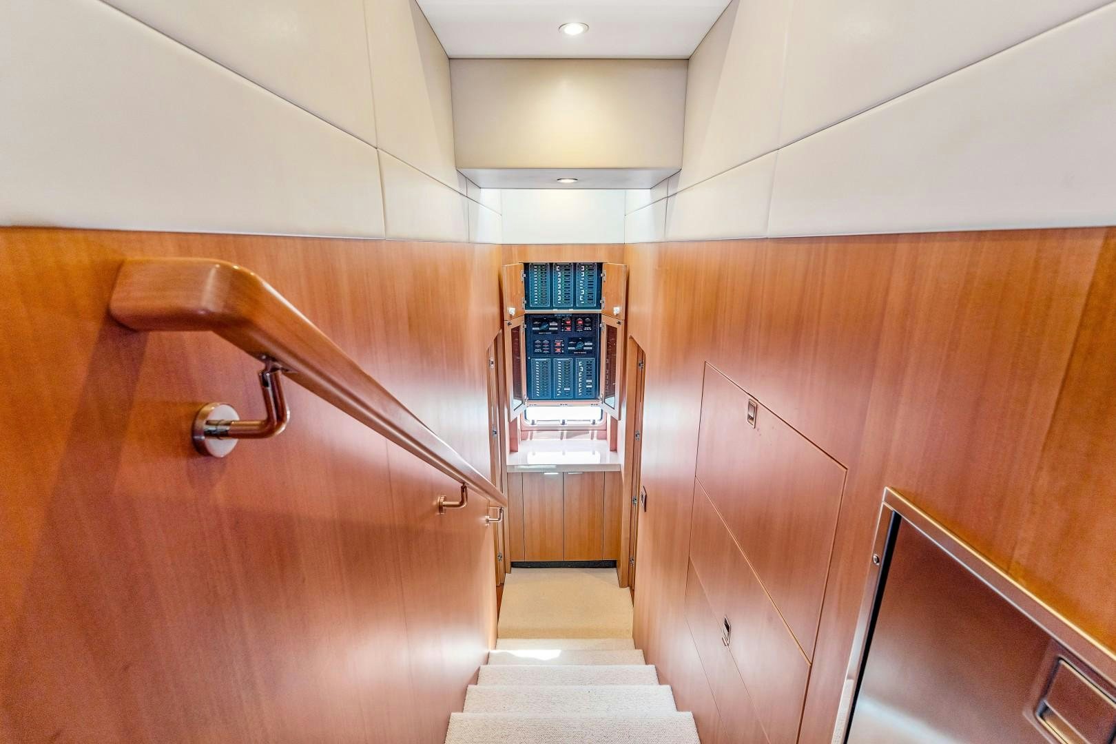 a wooden staircase in a room aboard No Name Yacht for Sale