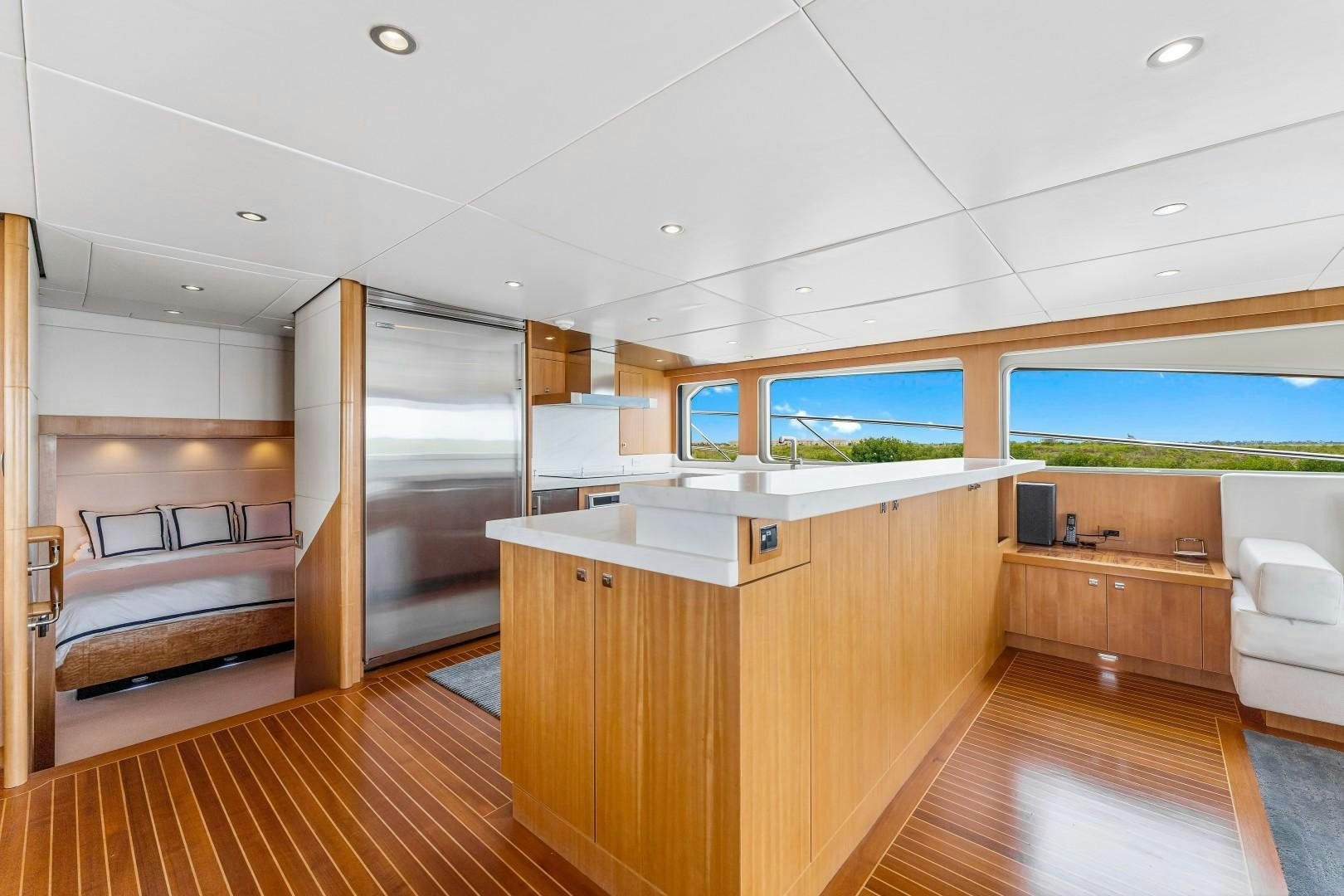 a room with a wood floor and a large window aboard No Name Yacht for Sale