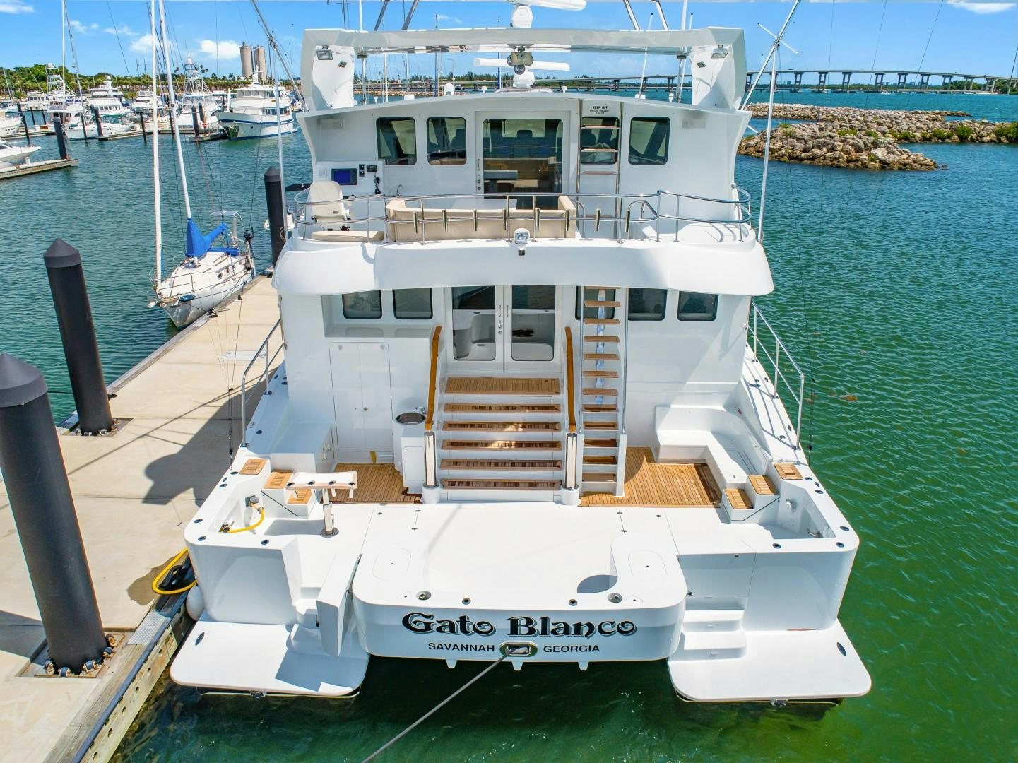 a boat docked at a pier aboard No Name Yacht for Sale
