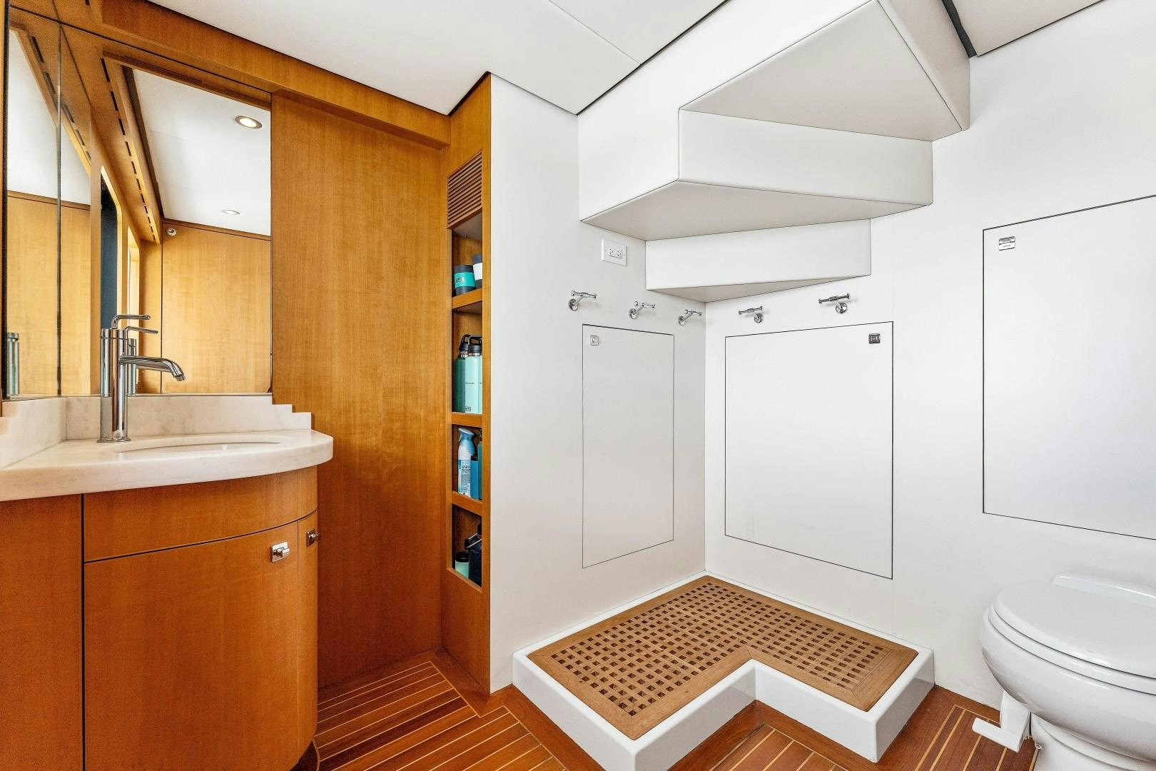 a bathroom with a toilet and sink aboard No Name Yacht for Sale