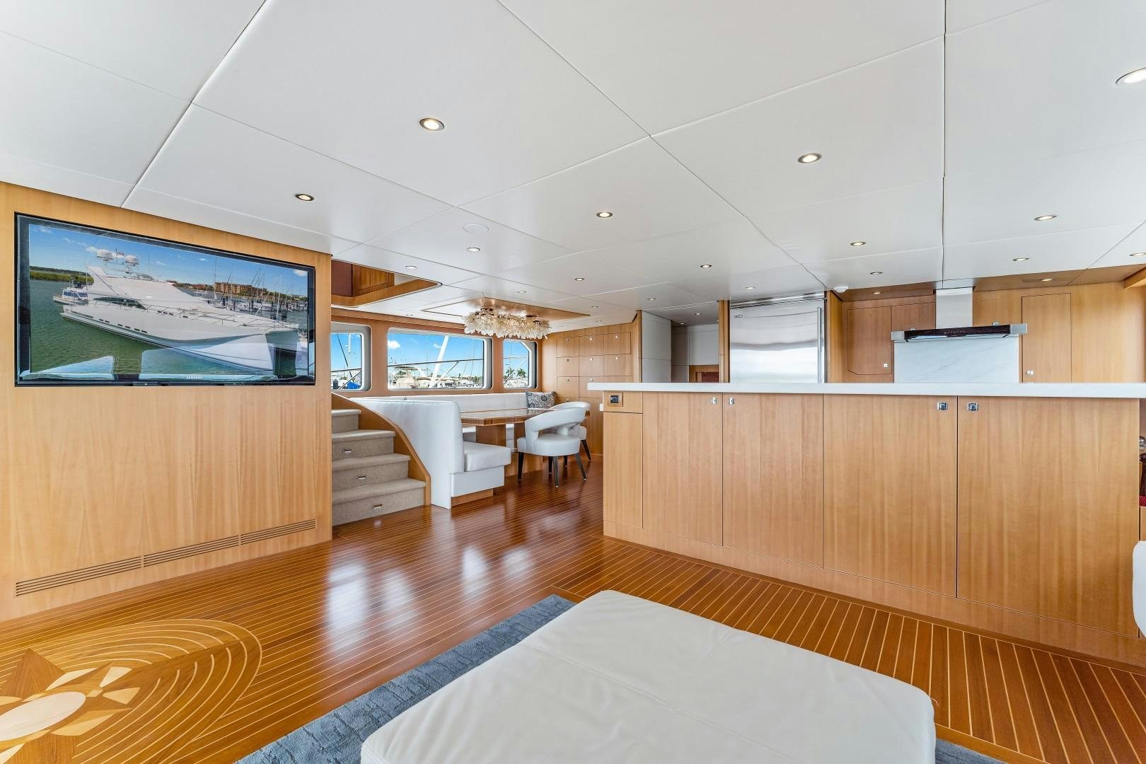 a room with wooden furniture aboard No Name Yacht for Sale