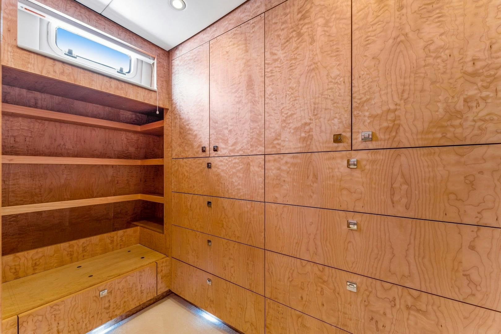 a wooden wall with wooden drawers aboard No Name Yacht for Sale