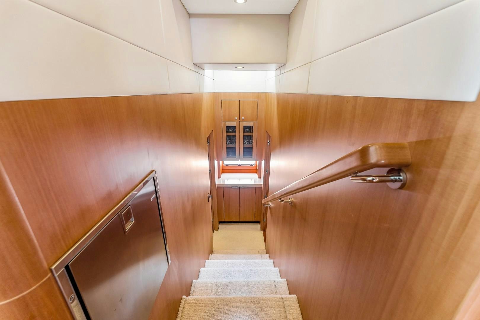 a wooden bathroom with a wood cabinet aboard No Name Yacht for Sale