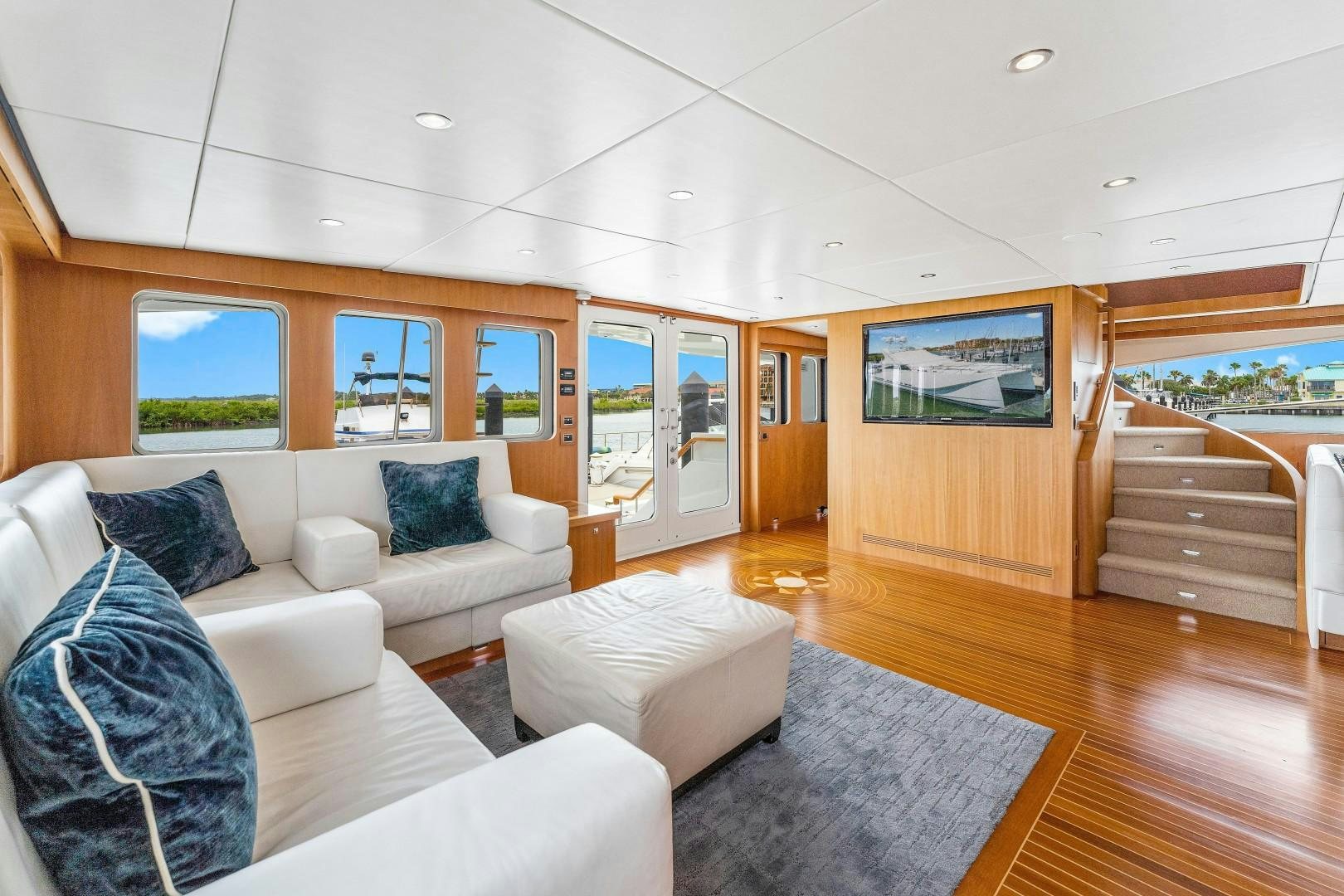 a living room with a large window aboard No Name Yacht for Sale