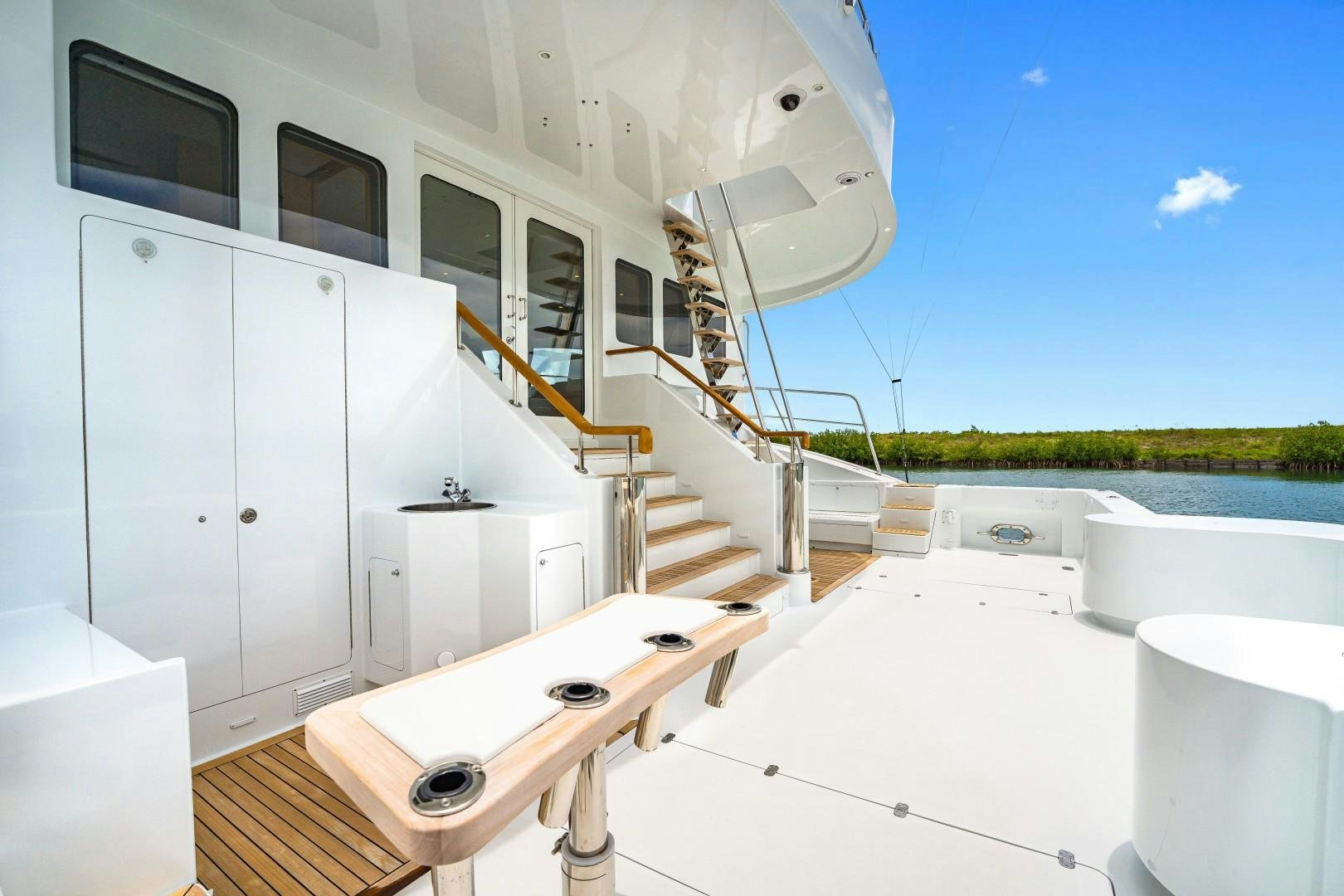 a white room with a white tub and a white sink aboard No Name Yacht for Sale