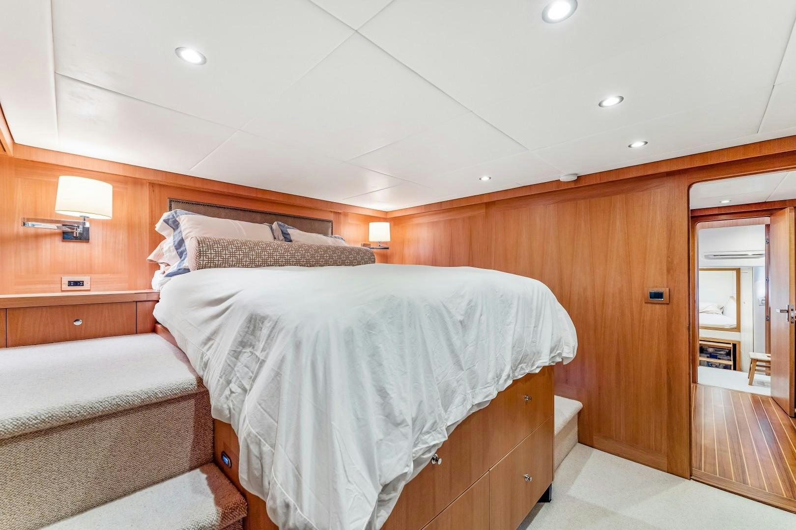 a room with a bed and a mirror aboard No Name Yacht for Sale