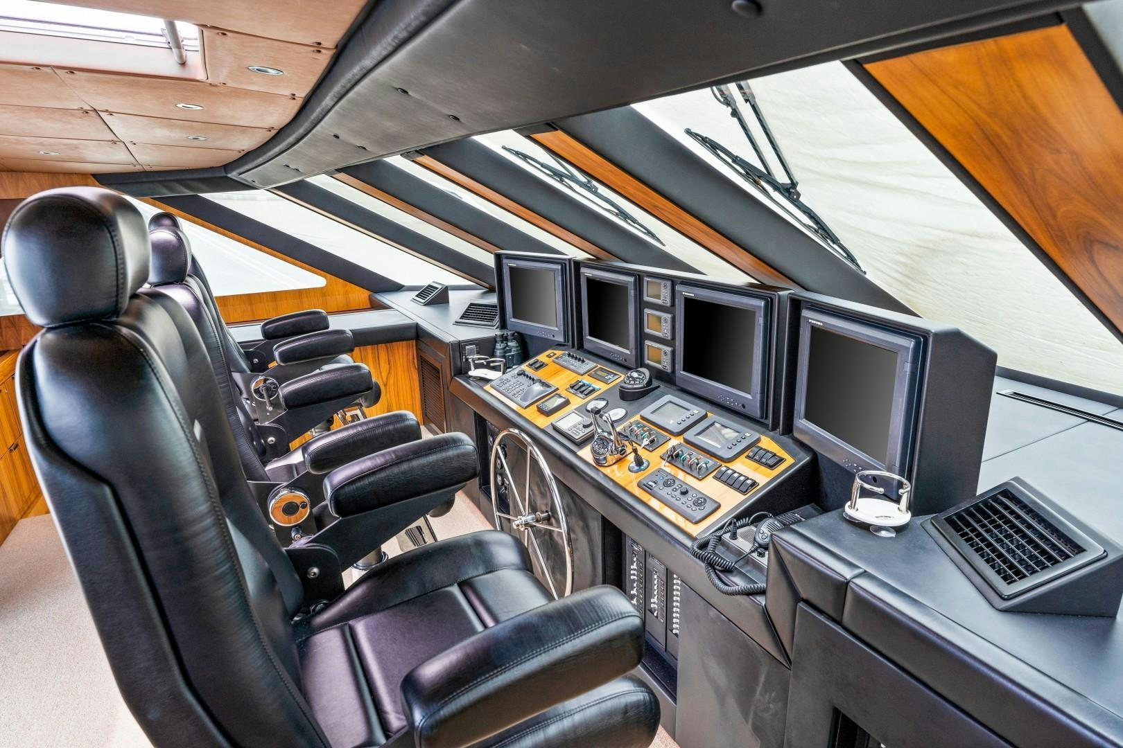 a vehicle with many monitors and keyboards aboard No Name Yacht for Sale