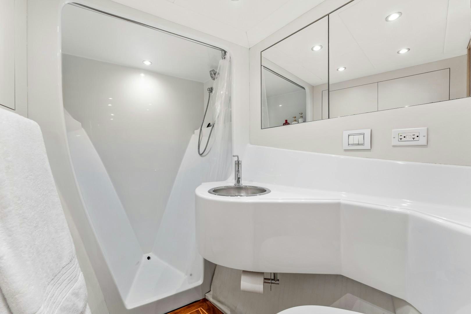 a bathroom with a sink and bathtub aboard No Name Yacht for Sale