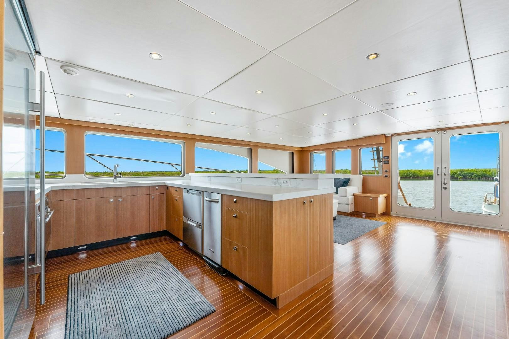 a large kitchen with wooden cabinets aboard No Name Yacht for Sale