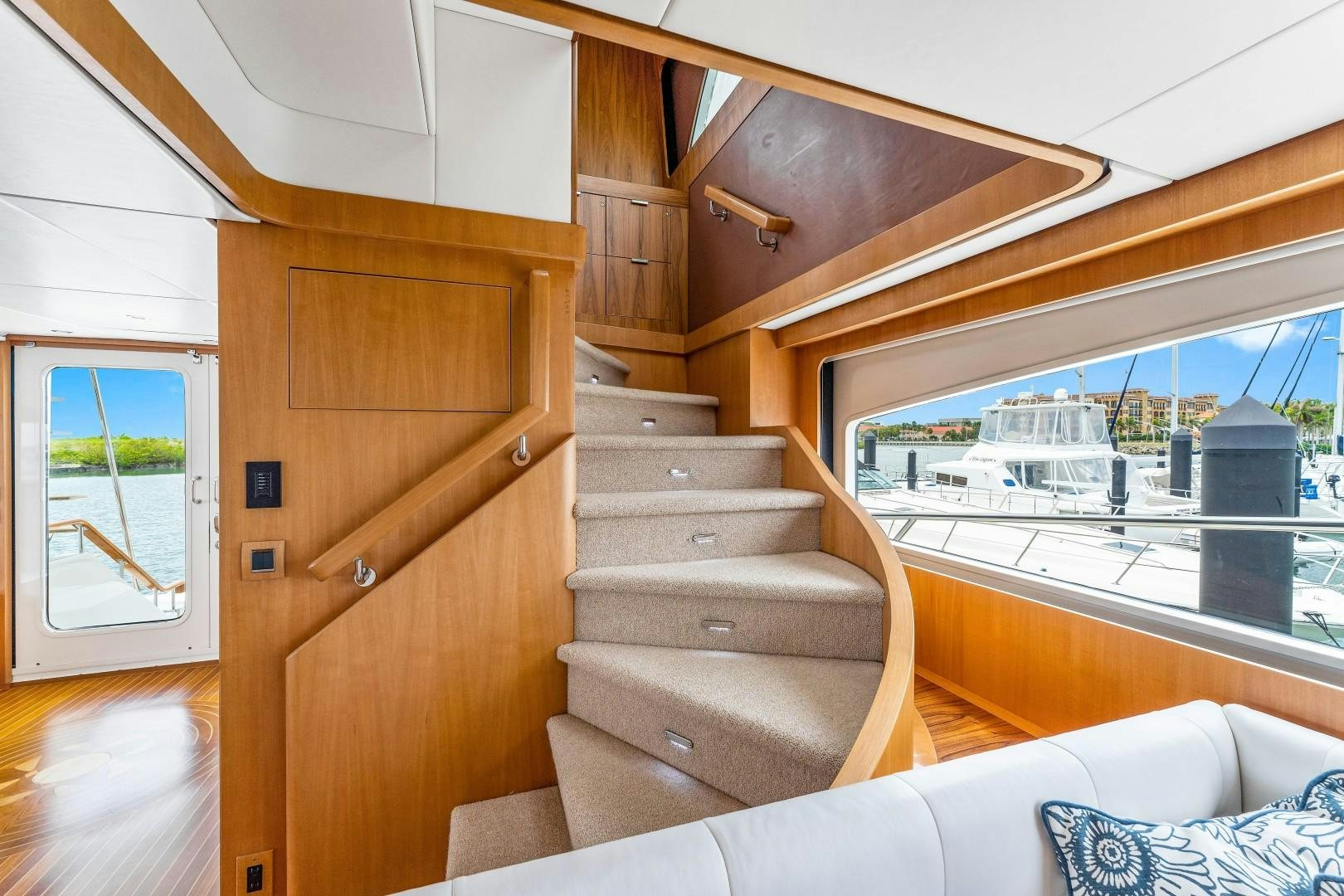a wooden staircase in a house aboard No Name Yacht for Sale