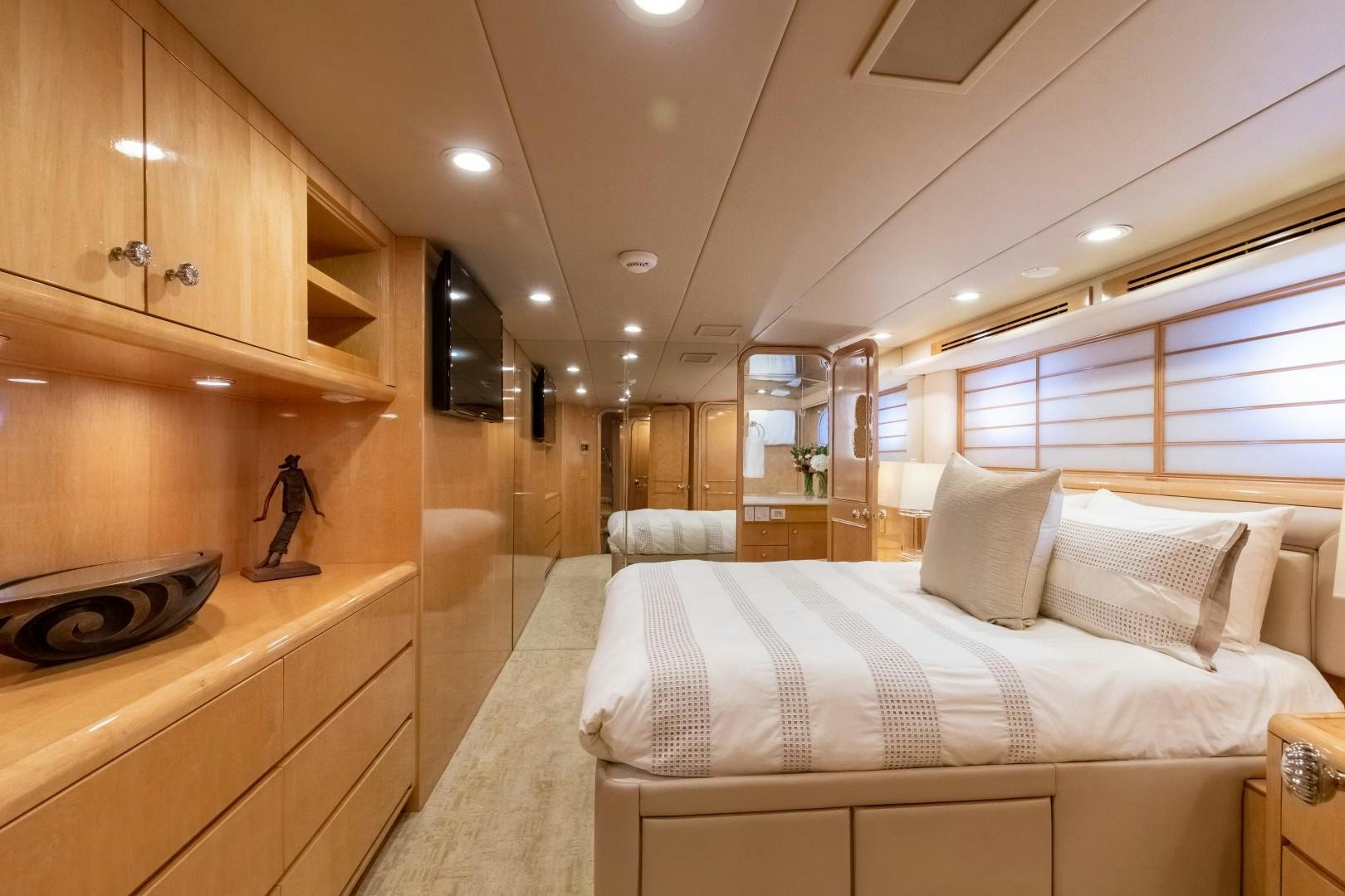 a large bedroom with a large bed aboard SINBAD Yacht for Sale