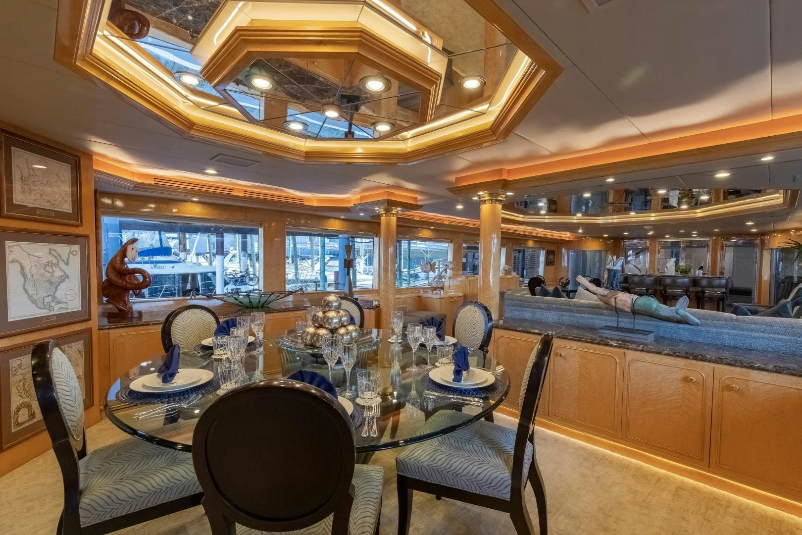 a dining room with a table and chairs aboard SINBAD Yacht for Sale