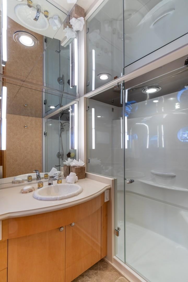 a bathroom with a sink and a shower aboard SINBAD Yacht for Sale