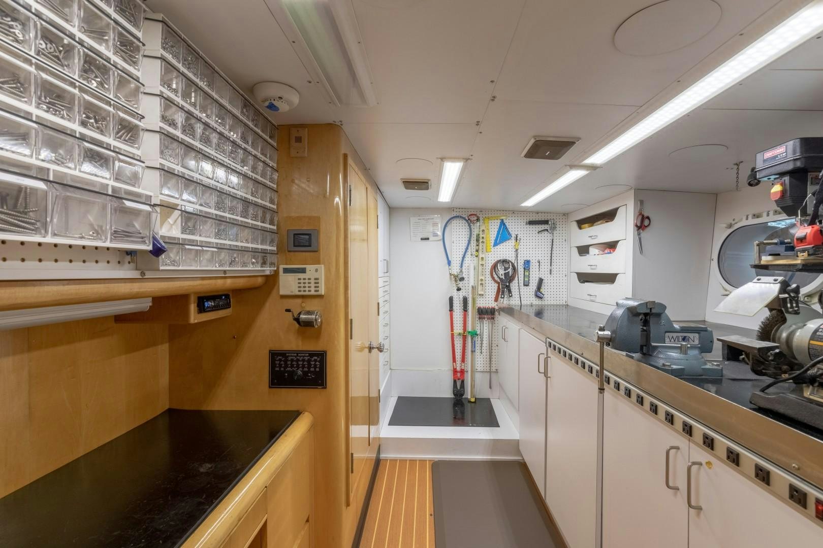 a kitchen with a counter and cabinets aboard SINBAD Yacht for Sale