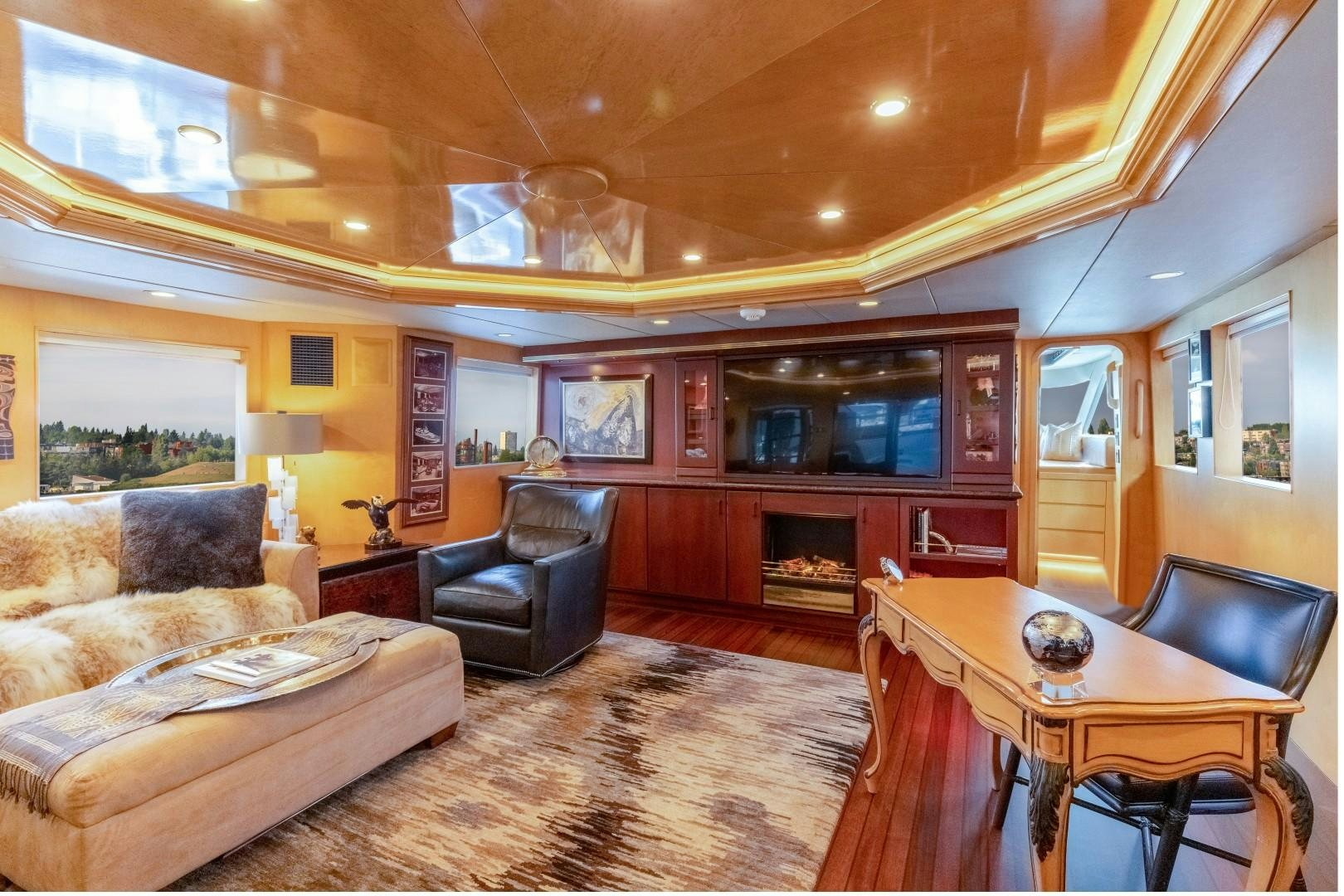 a living room with a dining table and couches aboard SINBAD Yacht for Sale