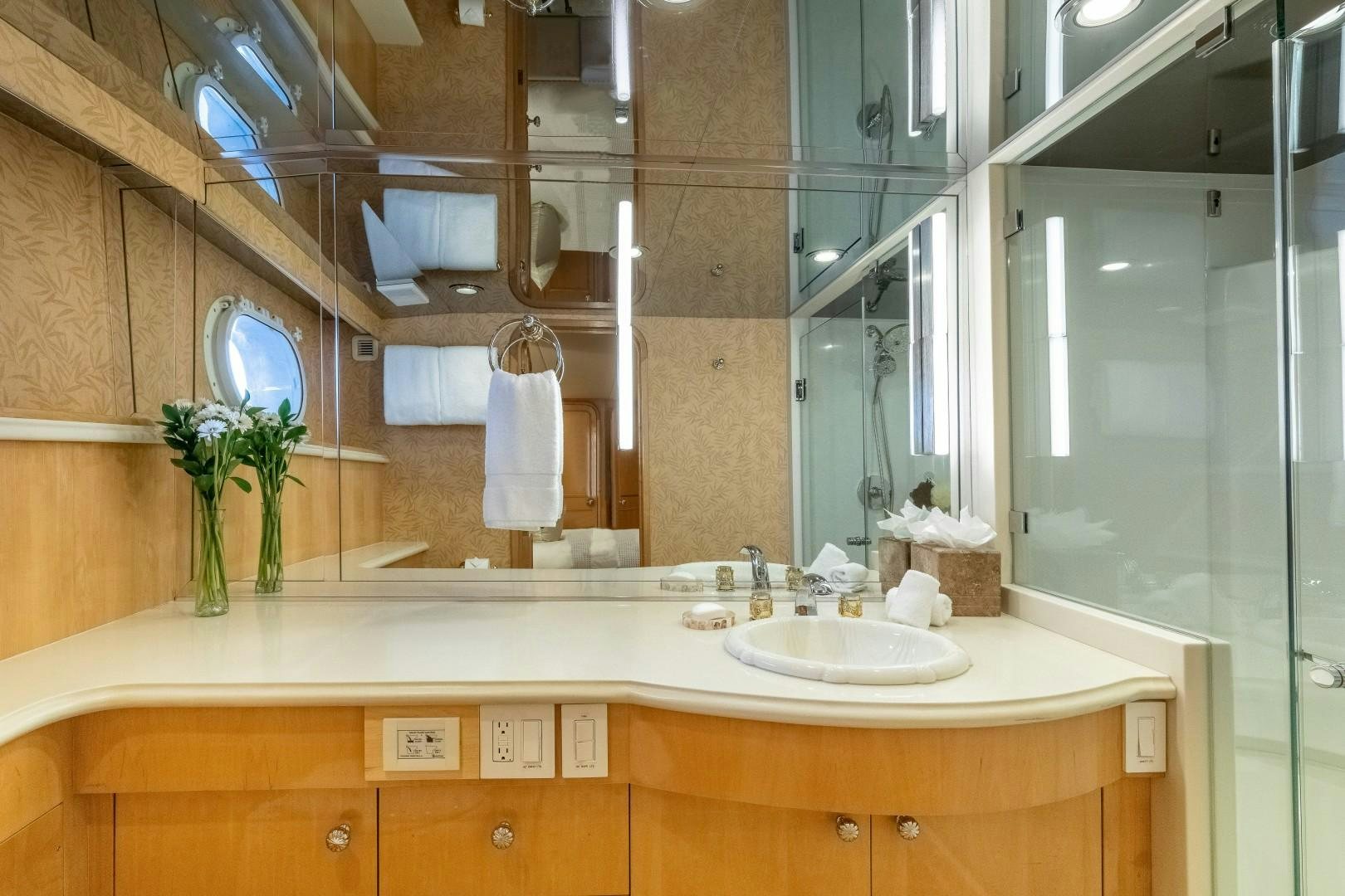 a bathroom with a large mirror aboard SINBAD Yacht for Sale
