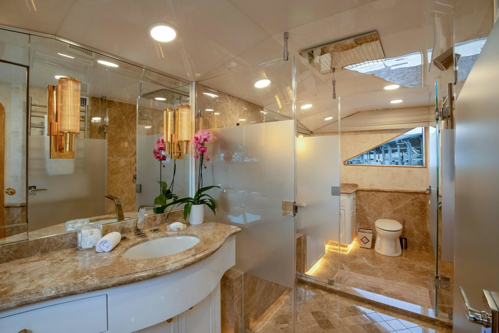 a bathroom with a sink and a toilet aboard SINBAD Yacht for Sale