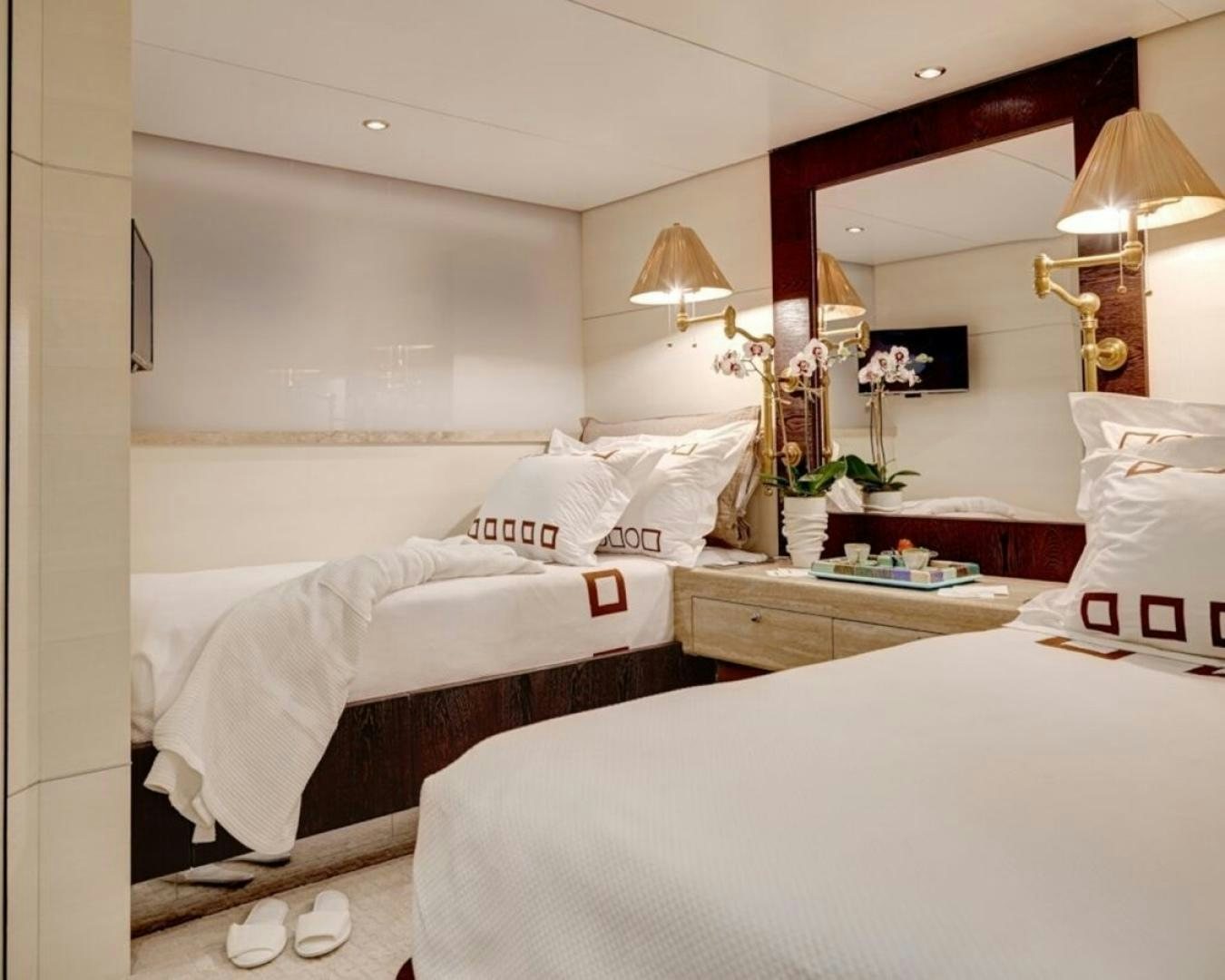 a couple of beds in a hotel room aboard HIGHLANDER Yacht for Sale
