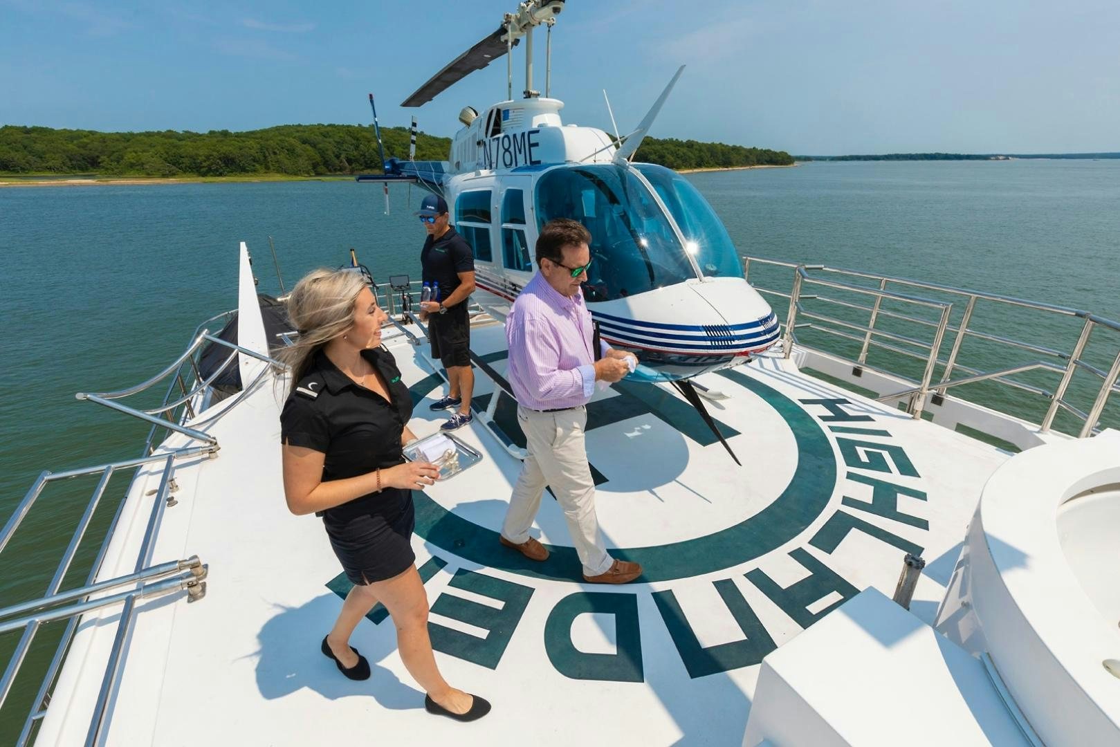 a group of people on a boat aboard HIGHLANDER Yacht for Sale