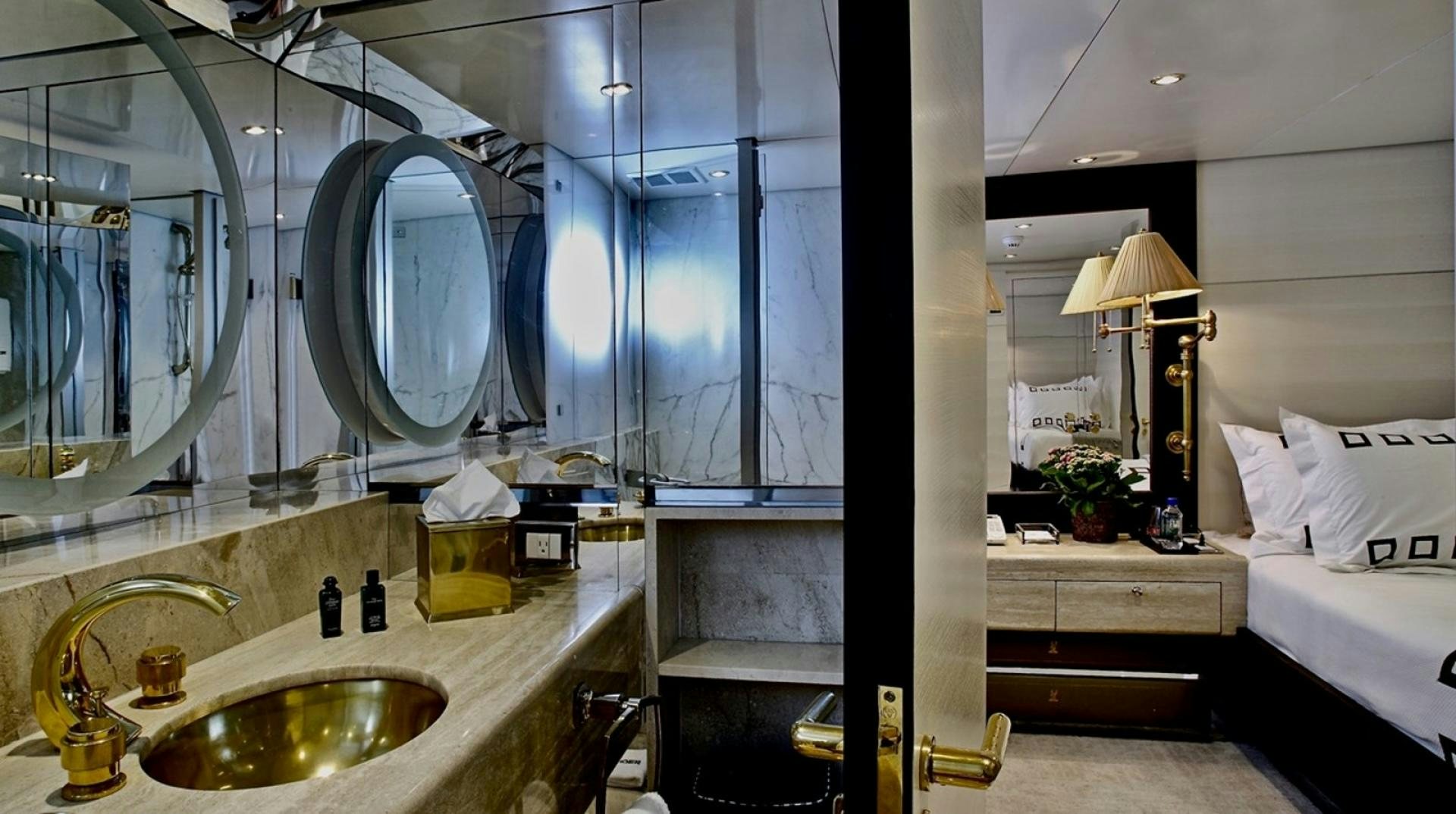 a bathroom with a sink and a bed aboard HIGHLANDER Yacht for Sale