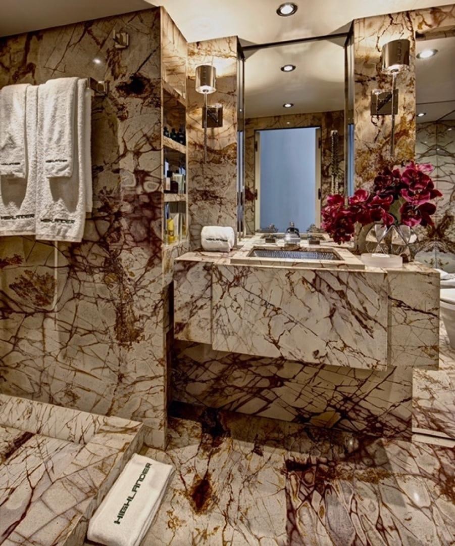 a bathroom with a sink and a mirror aboard HIGHLANDER Yacht for Sale