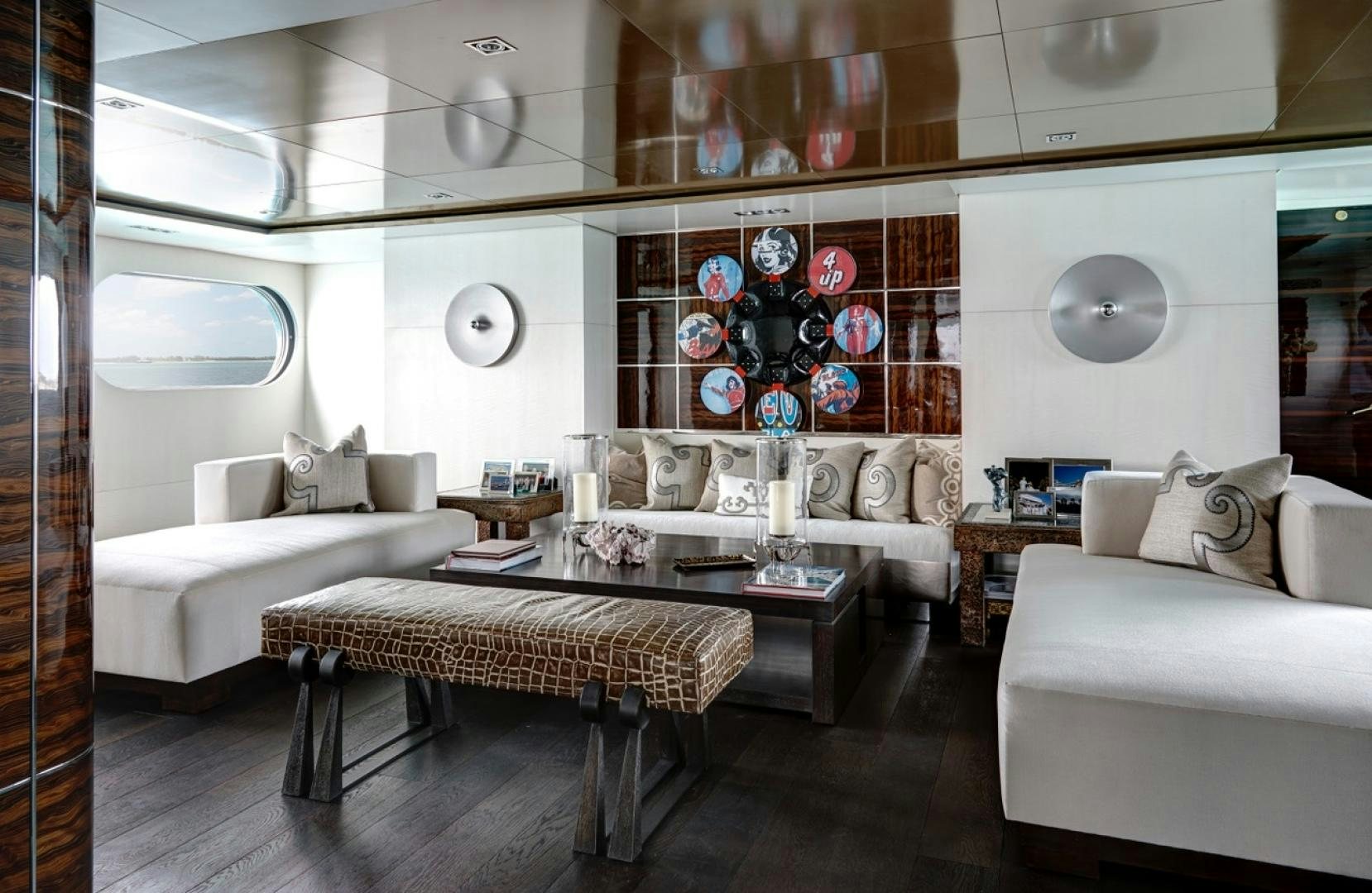 a living room with a large mirror aboard HIGHLANDER Yacht for Sale