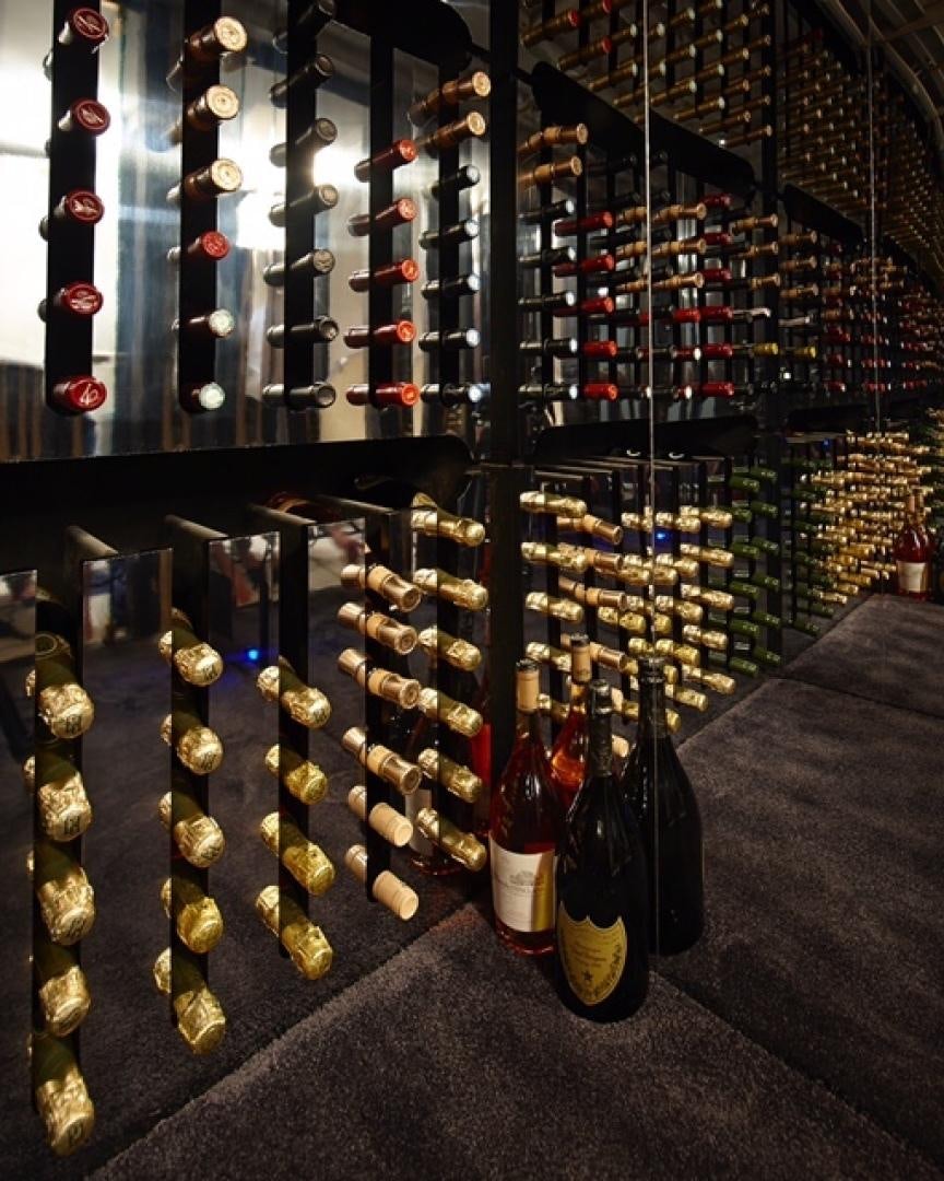 bottles of wine on shelves aboard HIGHLANDER Yacht for Sale