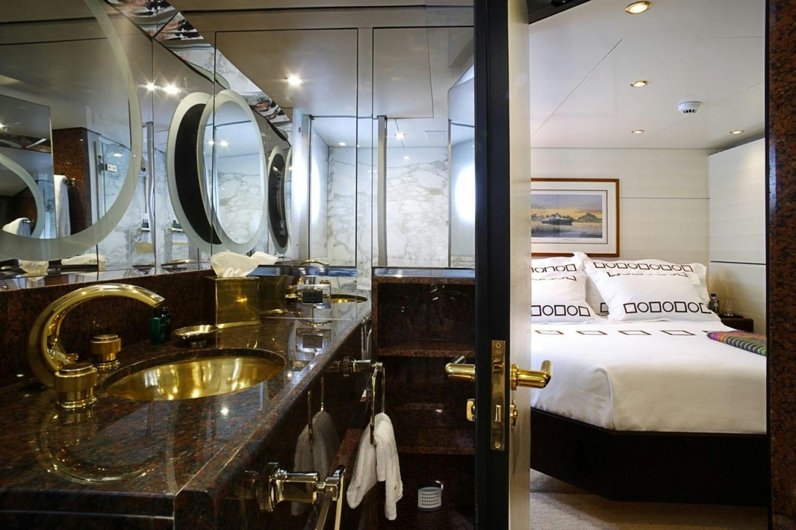 a bathroom with a sink and a bed aboard HIGHLANDER Yacht for Sale