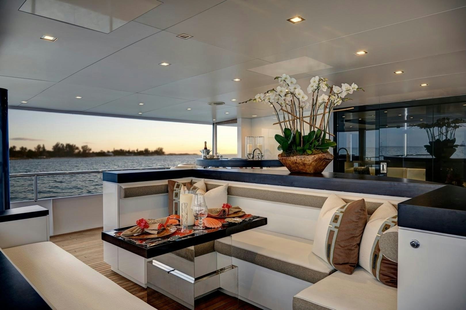 a modern kitchen with a large island aboard HIGHLANDER Yacht for Sale