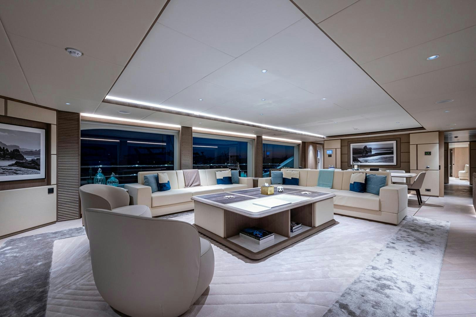 a modern living room with a large open floor plan aboard LIRA Yacht for Sale