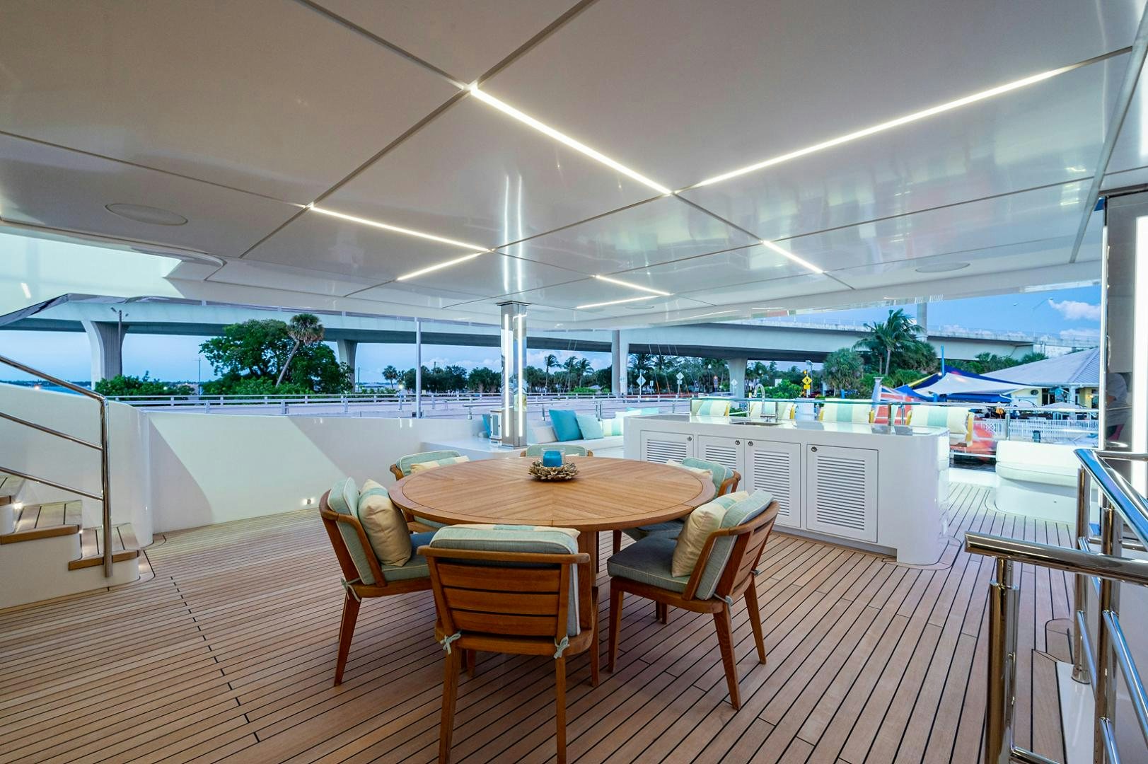 a table and chairs in a room aboard LIRA Yacht for Sale