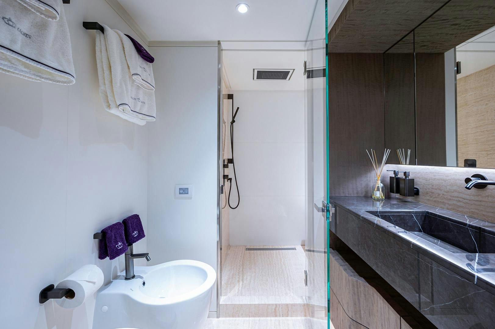a bathroom with a sink and a toilet aboard LIRA Yacht for Sale