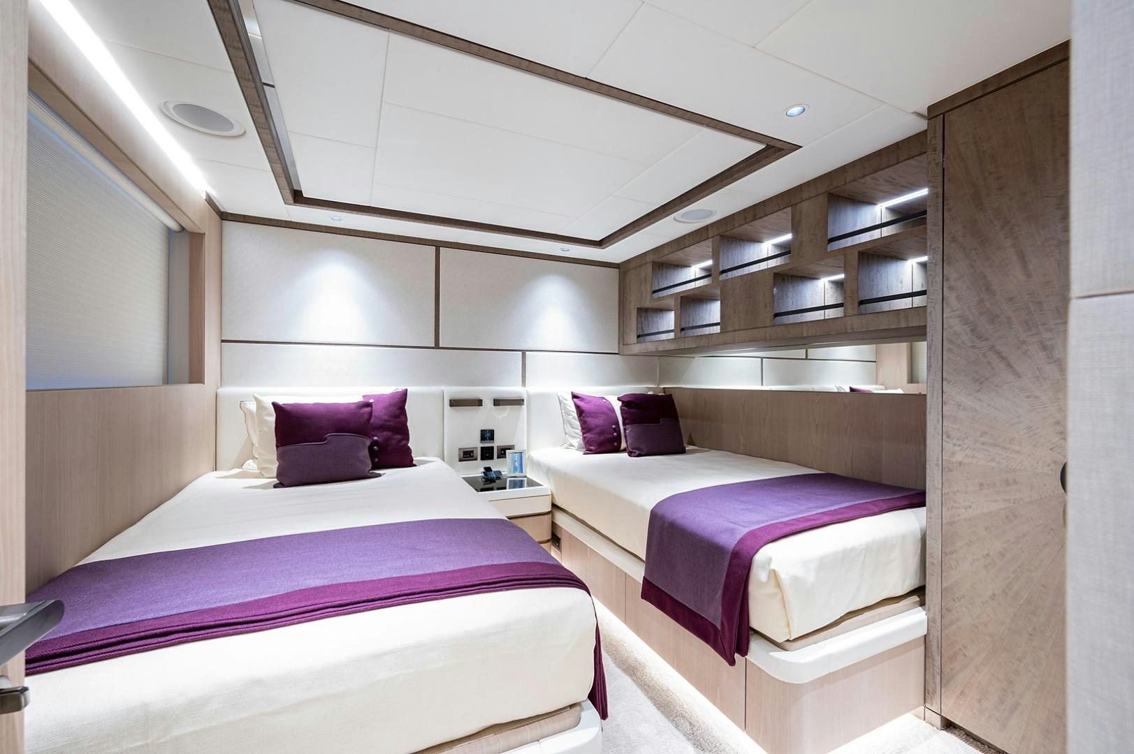 a couple of beds in a room aboard LIRA Yacht for Sale