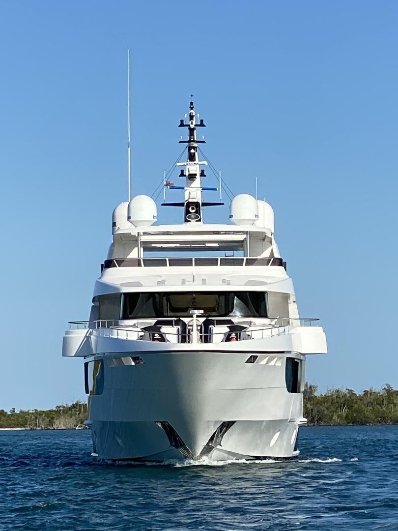 a large white boat in the water aboard LIRA Yacht for Sale