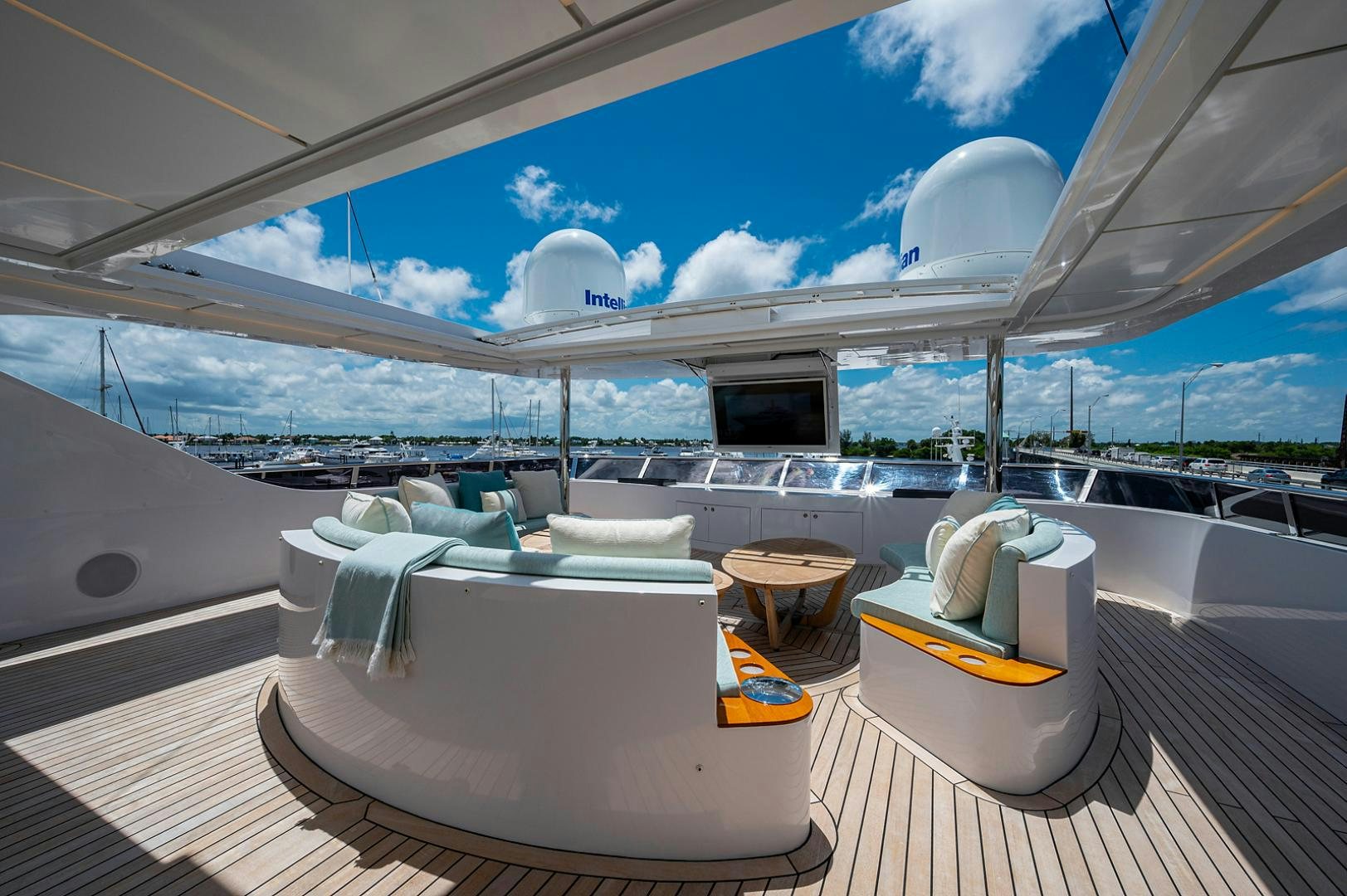 a room with a table and chairs aboard LIRA Yacht for Sale