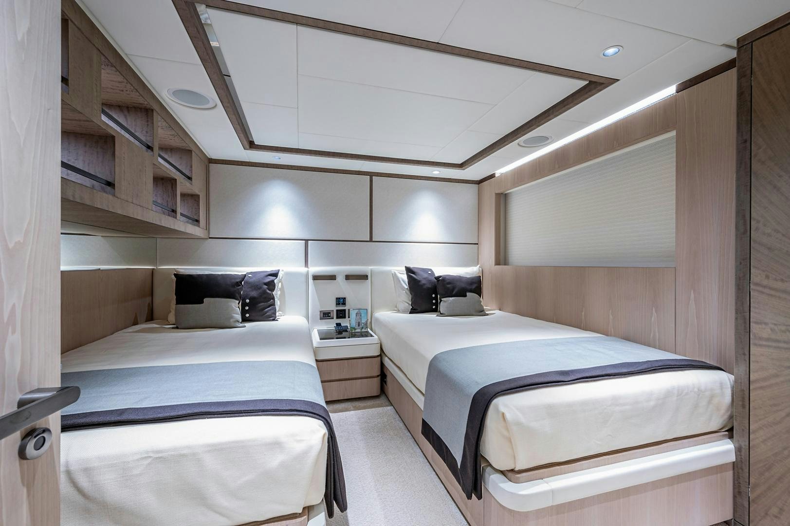 a room with two beds aboard LIRA Yacht for Sale