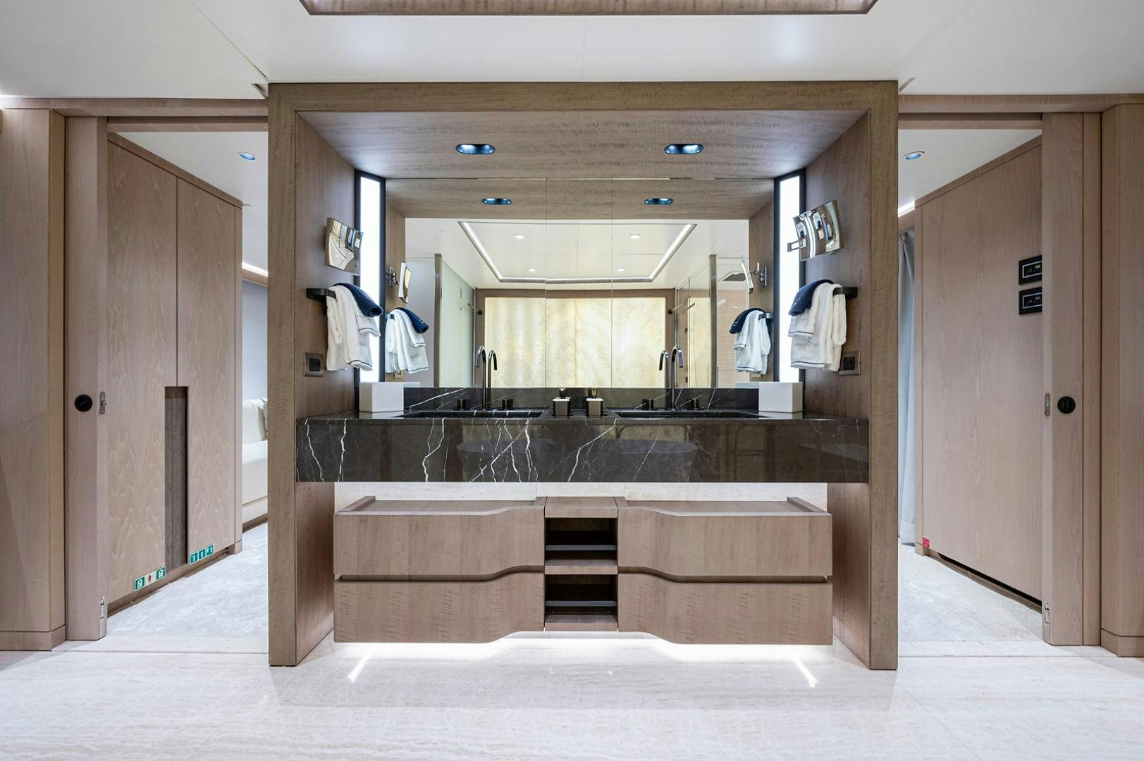 a bathroom with a large mirror aboard LIRA Yacht for Sale